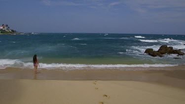 Woman In Surf On Indian Ocean Beach, Tangalle, Sri Lanka