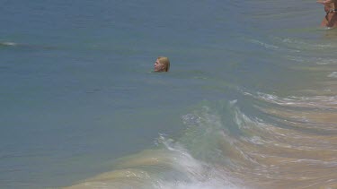 Women Are Swept Backwards By Indian Ocean Surf, Unawatuna, Sri Lanka