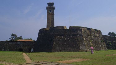 Lady, Pink Parasol & Clock Tower, Galle Forte, Sri Lanka