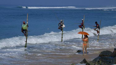 Stilt Fishermen & Model With Umbrella, Midigama, Sri Lanka