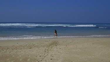 Model Walks On Beach In Multicoloured Shawl, Midigama, Sri Lanka