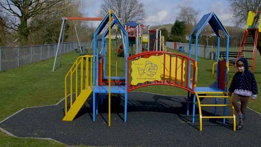 Young Girl On Climbing Frame, Lambourne, England