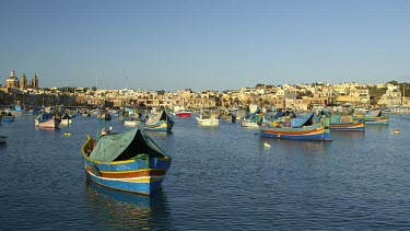 Multi-Coloured Fishing Boats & Town, Marsaxlokk, Malta