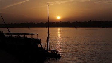 Boat Silhouette & Sunset, River Nile, Luxor, Egypt