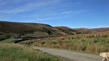 Walkers & Wind Turbines On Moor, Naden Lower Reservoir, Wolstenholme, Lancashire
