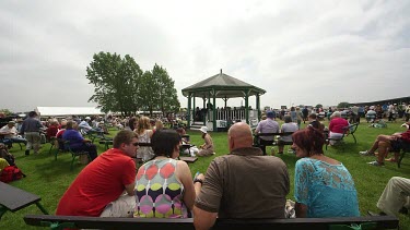 Showgoers Sat Around Bandstand, The Great Yorkshire Show, North Yorkshire