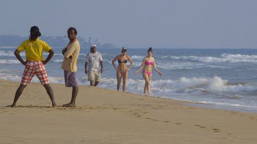 People Walking On Indian Ocean Beach, Bentota, Sri Lanka