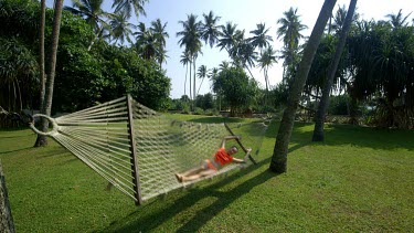 Woman On Rope Hammock, Bentota Beach, Sri Lanka