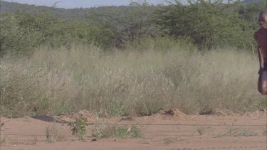 Feet legs of African man running towards camera