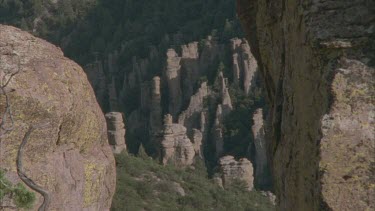 zoom out from eroded rock formation to eroded rock formation