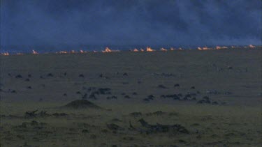 fire on horizon, plains in front