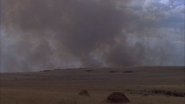 smoke from fire looms over horizon