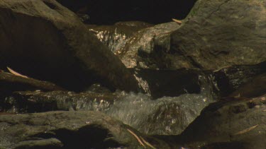 stream flowing over rocks and boulders