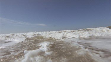 waves breaking on a beach