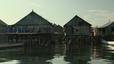 Boating by a village on stilts