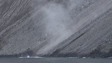 Volcano rocks hitting the water