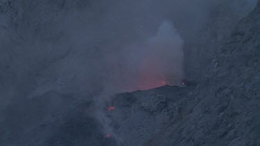 Red hot lava and smoke on a volcano