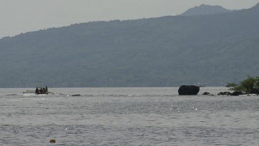 Boating by a volcano on the coast