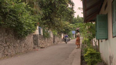 People on a quiet whaling village street