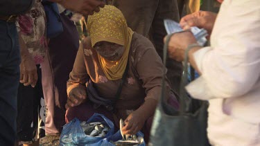 Woman selling fish in a market