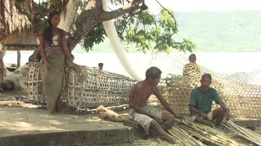 Villagers on shore in Abangbul village