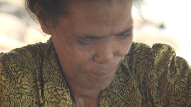 Close up of a woman weaving