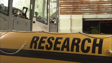 Yellow inflatable boat with Research written along the side