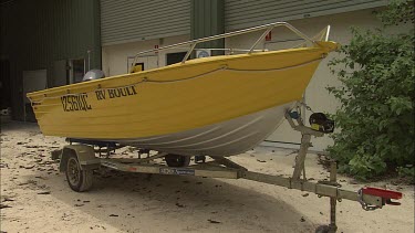 Yellow dinghy on a trailer