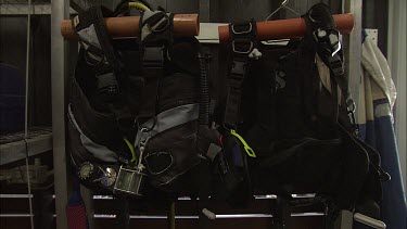 Scuba diving equipment on a rack
