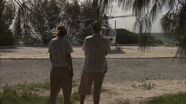 Helicopter taking off from a beach