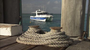 Great Barrier Reef Marine Park authority ship anchored by a pier
