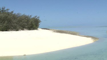 On boat parked on Heron Island Pier and view of beach shore