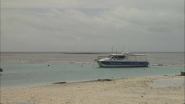 Various of boats tied near beach shore and pier