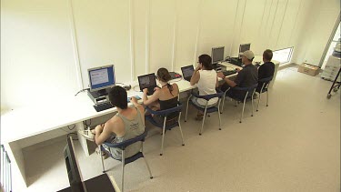 Student researchers working on computers