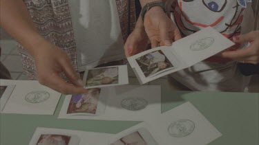 Tourist looking at their developed photos