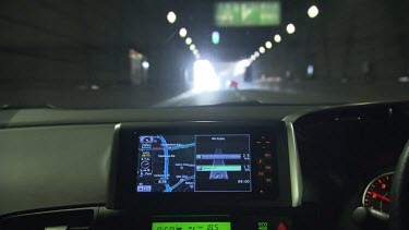 Driving a car through a tunnel with a GPS on the dashboard