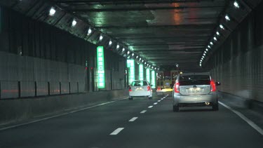 Traffic through a tunnel at night