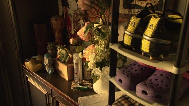 Cleats and gardening supplies in a mudroom
