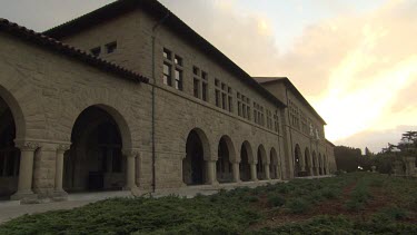 Old stone building with columns down the corridor