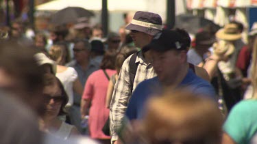 Pedestrians walking on a busy street