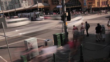 Time lapse of traffic and pedestrians on a busy city street