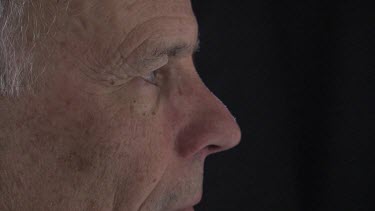 Close up of a man looking at a computer screen