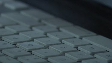 Close up of a woman typing on a keyboard