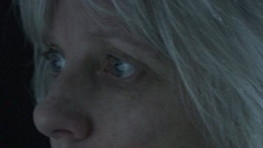 Close up of a woman with blonde hair and blue eyes