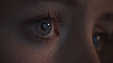 Close up of a woman with grey eyes