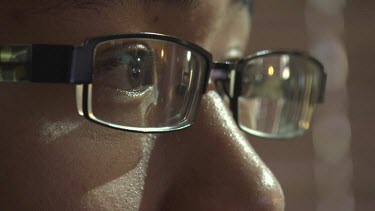 Close up of a man with brown eyes and glasses