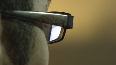 Reflection of a television screen in eye glasses