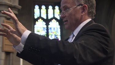 Conductor conducts in a church