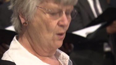 Woman singing in a church choir
