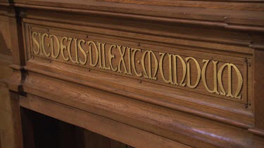 Inscription on a wooden church pew